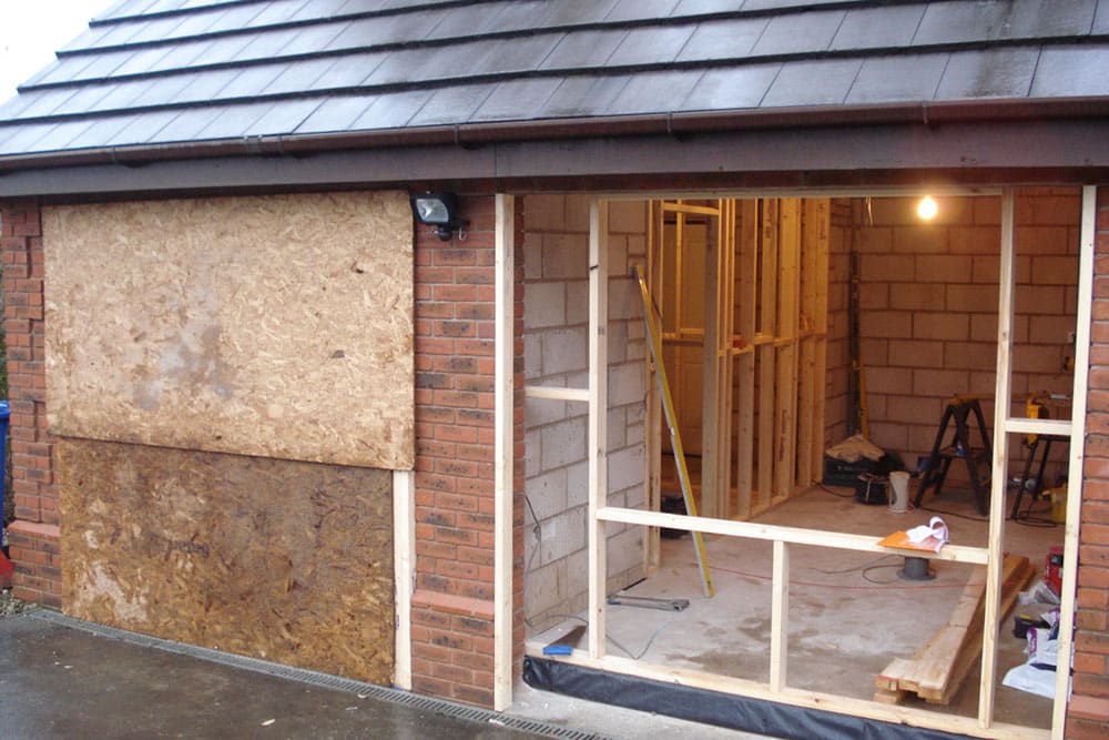 professional tiler working on external tiling