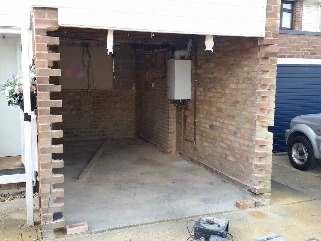 professional tiler working on external tiling