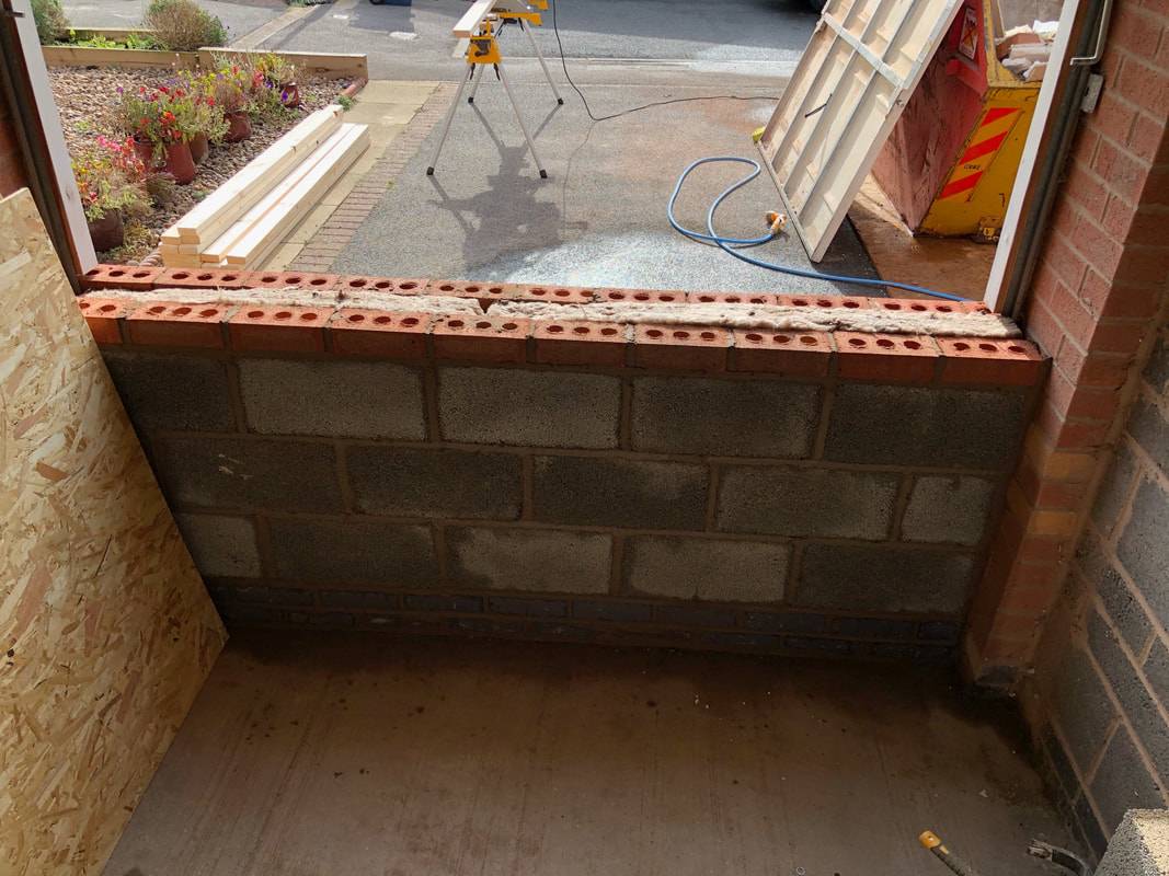 professional tiler working on external tiling