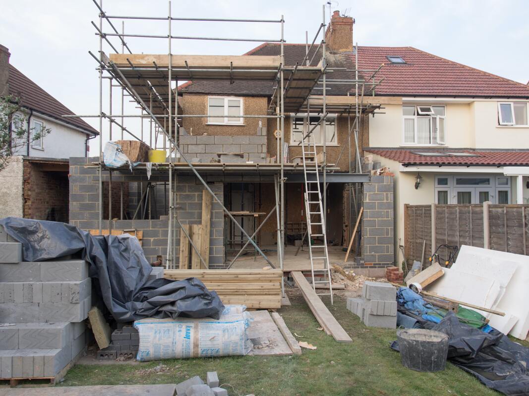 professional tiler working on external tiling