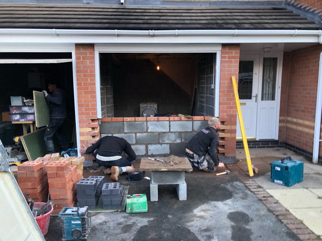 professional tiler working on bathroom tiling 